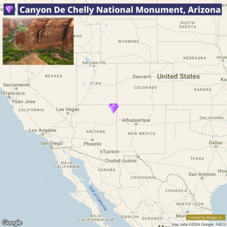 A map showing the location of Canyon De Chelly National Monument in Arizona, United States, with a purple diamond-shaped marker indicating the monument's position, along with a small inset photo of the canyon's sandstone cliffs and vegetation.