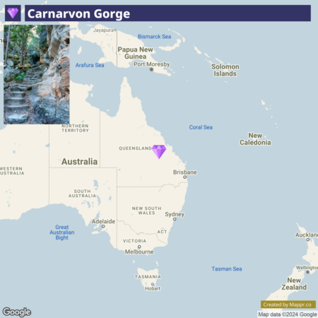 A map highlighting the location of Carnarvon Gorge in Queensland, Australia, with an inset photo of the rocky terrain and stairs within the gorge.