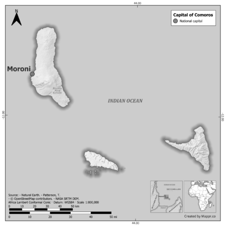 Black and white map of Comoros highlighting Moroni as the capital, with neighboring countries.
