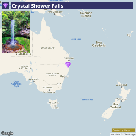 A map showing the location of Crystal Shower Falls in Australia with Australia, Tasmania, and parts of New Zealand and other Pacific islands visible. In the inset, a photograph of the Crystal Shower Falls features a single waterfall cascading into a pool surrounded by lush greenery.