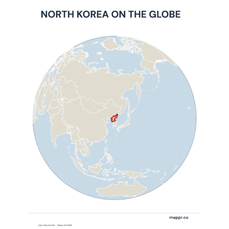 A map highlighting North Korea's location on a globe, marked with a red outline.